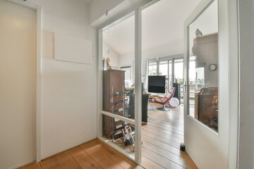 the inside of a house with wood floors and sliding glass doors that lead to an outdoor patio, which...