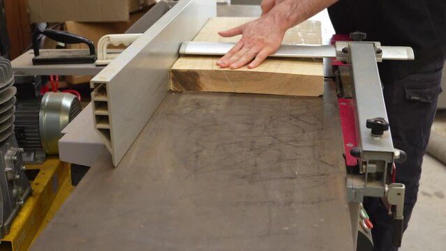 Flattening piece of Ash wood on jointer machine
