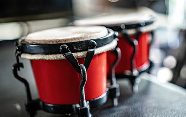Red drums in recording studio for hard beat perfomance. Professional musical instrument for rock...