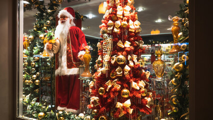 Christmas shop window with Santa Claus and Christmas tree
