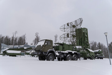 Heavy military equipment of Russian armed forces against the background of a winter forest. Radio...