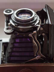 Vintage old medium format collectable camera with open lens bellows, macro closeup.