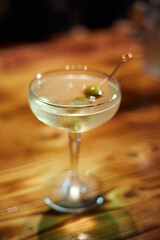 Martini Glass with Green Olives