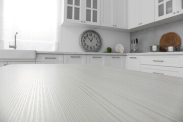 White wooden table in kitchen, closeup. Interior design