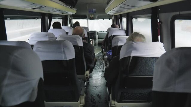 Minibus with passengers on the move.