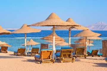 Idylic beach with sun umbrelas, Red Sea, Egypt