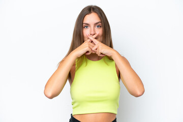 Young caucasian woman isolated on white background showing a sign of silence gesture