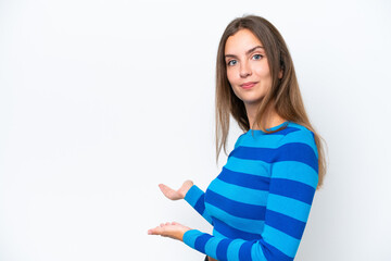 Young caucasian woman isolated on white background extending hands to the side for inviting to come