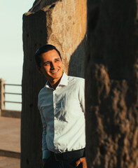 Obraz premium portrait of smiling man visiting ruins at sunrise in the sierra of ecuador