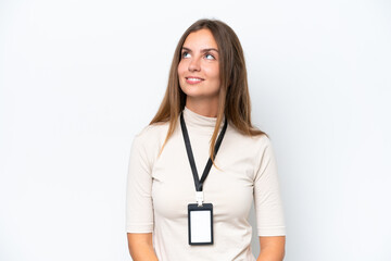 Young pretty woman with ID card isolated on white background thinking an idea while looking up