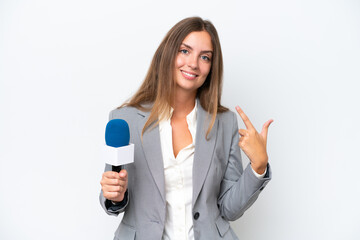 Young TV presenter caucasian woman isolated on white background giving a thumbs up gesture