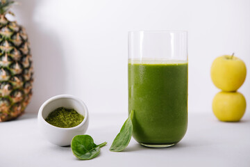 Glass of spinach detox juice with fruits