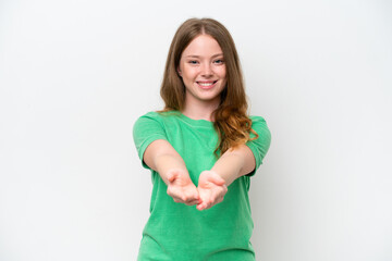 Young pretty woman isolated on white background holding copyspace imaginary on the palm to insert...