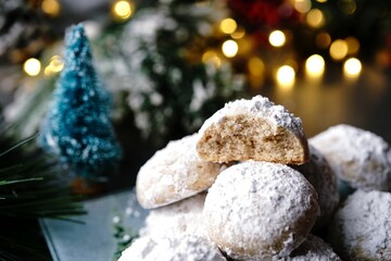 Homemade Snowball or Mexican wedding cookies on holiday background, selective focus