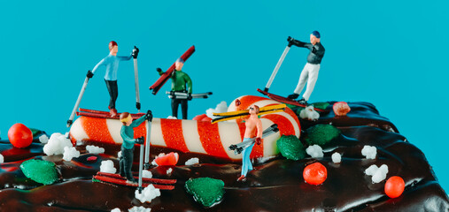 skiers on a yule log cake, banner format