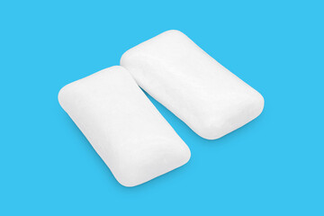 Three pieces of white chewing gum isolated on white. The whole subject is in focus.