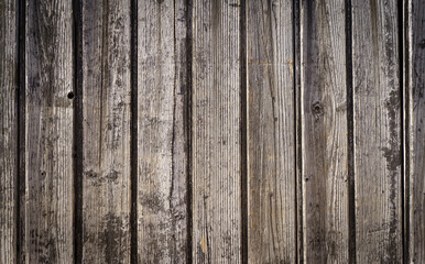 Wooden planks background wall. Textured rustic wood old paneling for walls, interiors and construction.