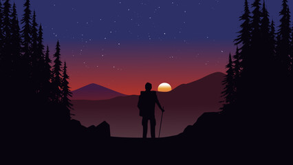 Amazing sunset in mountain forest with an explorer looking at the mountain