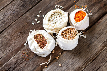 Obraz na płótnie Canvas Grains bags lentils, chickpeas, buckwheat and beans