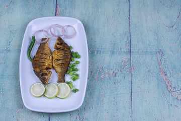 Delicious fresh fish fry with onion,lemon and chillies