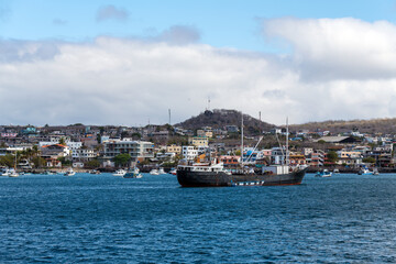 Fototapeta premium Harbor with ships and cityscape of Puerto Baquerizo Moreno, Galapagos national park, Ecuador.