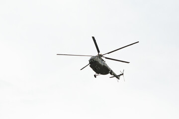 Fototapeta premium Helicopter flyung on the sky