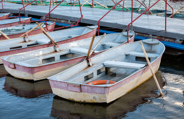 Fototapeta na wymiar several old boats near the pier