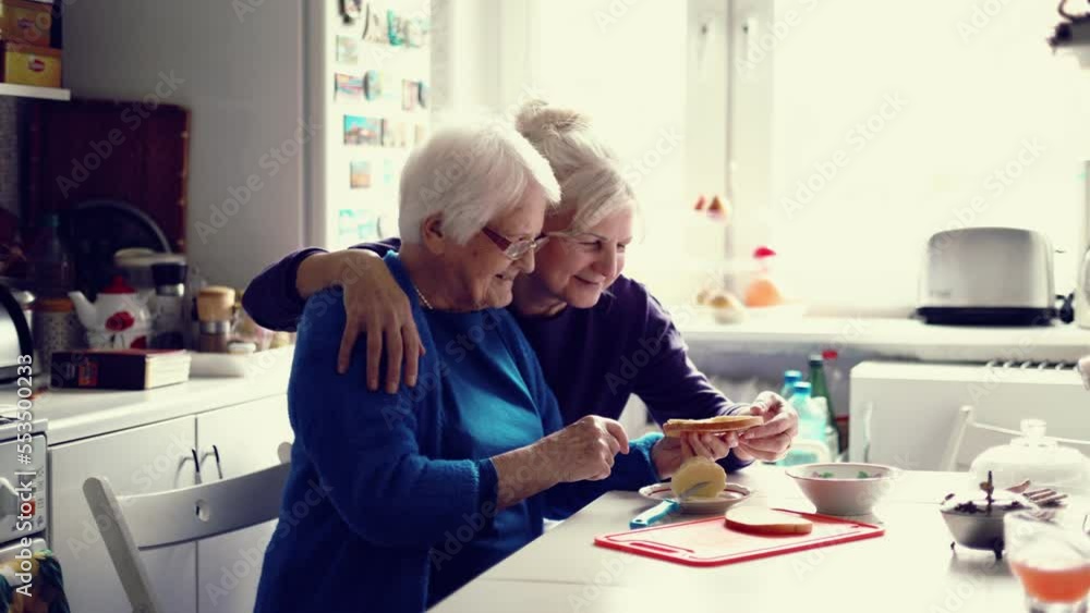 Sticker Woman spending time with her elderly mother at home
