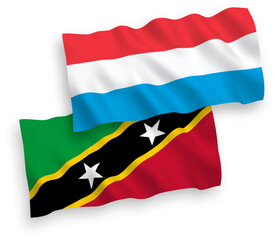 Flags of Federation of Saint Christopher and Nevis and Luxembourg on a white background