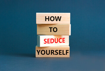 How to seduce yourself symbol. Concept word How to seduce yourself on wooden blocks. Beautiful grey table grey background. Business and how to seduce yourself concept. Copy space.