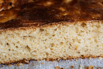 Texture of bread. Homemade bread with cheese and onions, close-up.