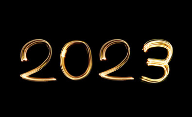 2023 written with shiny lights. New year 2023 concept photo. Light painting.