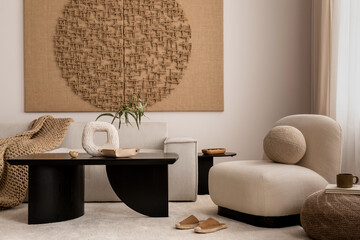 Warm and cozy living room interior with mock up poster frame, modern coffee table, modular sofa, oval shapes armchair, vase with dried flowers, pillows and personal accessories. Home decor. Template.