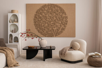 Aesthetic composition of japandi living room interior with mock up poster frame, modern black coffee table, vase with rowan, rounded shapes armchair and personal accessories. Home decor. Template.