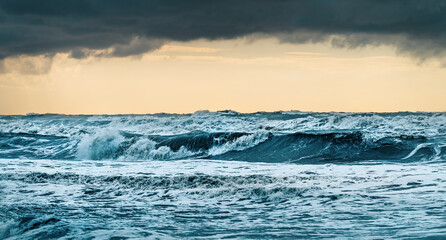 Storm sea waves with foam. Dramatic ocean landscape.