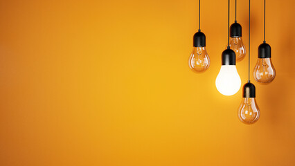 The concept of a light bulbs on an orange background, place for text and design, light bulbs...