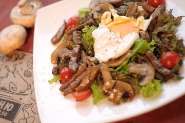 restaurant dish for the holidays, salad with poached egg