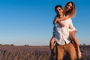 Tender couple posing in a lavender field