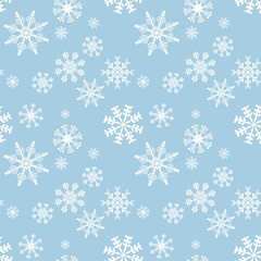 Winter seamless pattern with white snowflakes on a blue background
