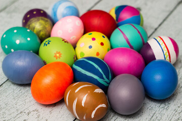 Fototapeta na wymiar Colorful collection of patterned easter eggs on wooden table