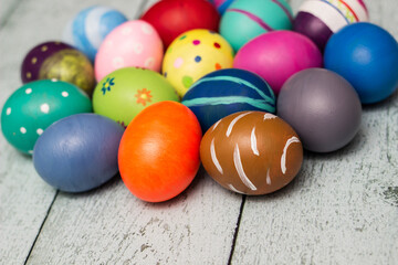 Colorful collection of patterned easter eggs on wooden table