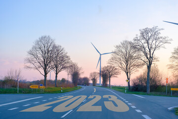 2023 on the road with arrows pointing forward, the concept begins to move towards success, new year...