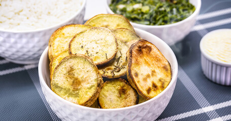 Pot of fried or baked sweet potatoes, sliced ​​and served hot, typical food from Brazil