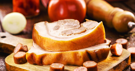 raw bacon slices and pork sausage, pork pork meat on wooden table, pork fat used as a cooking ingredient in brazil