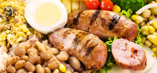 typical brazilian meal, rice and beans, tomato salad, boiled egg and french fries, called a traditional dish or executive dish, brazilian restaurant food