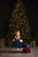 little child decorating christmas tree