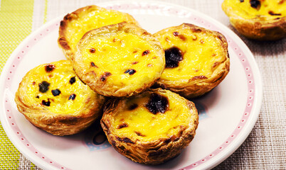 Portuguese Pastel de Nata, called Pastel de Belem, traditional Portuguese delicacy made with eggs,...