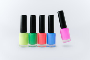 Among the five colors, pink nail polish floats.