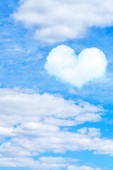 Naklejka na ściany i meble cumulus clouds on blue sky with heart shaped cloud. vertical frame