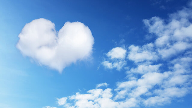 on the blue sky a cloud in the shape of a heart